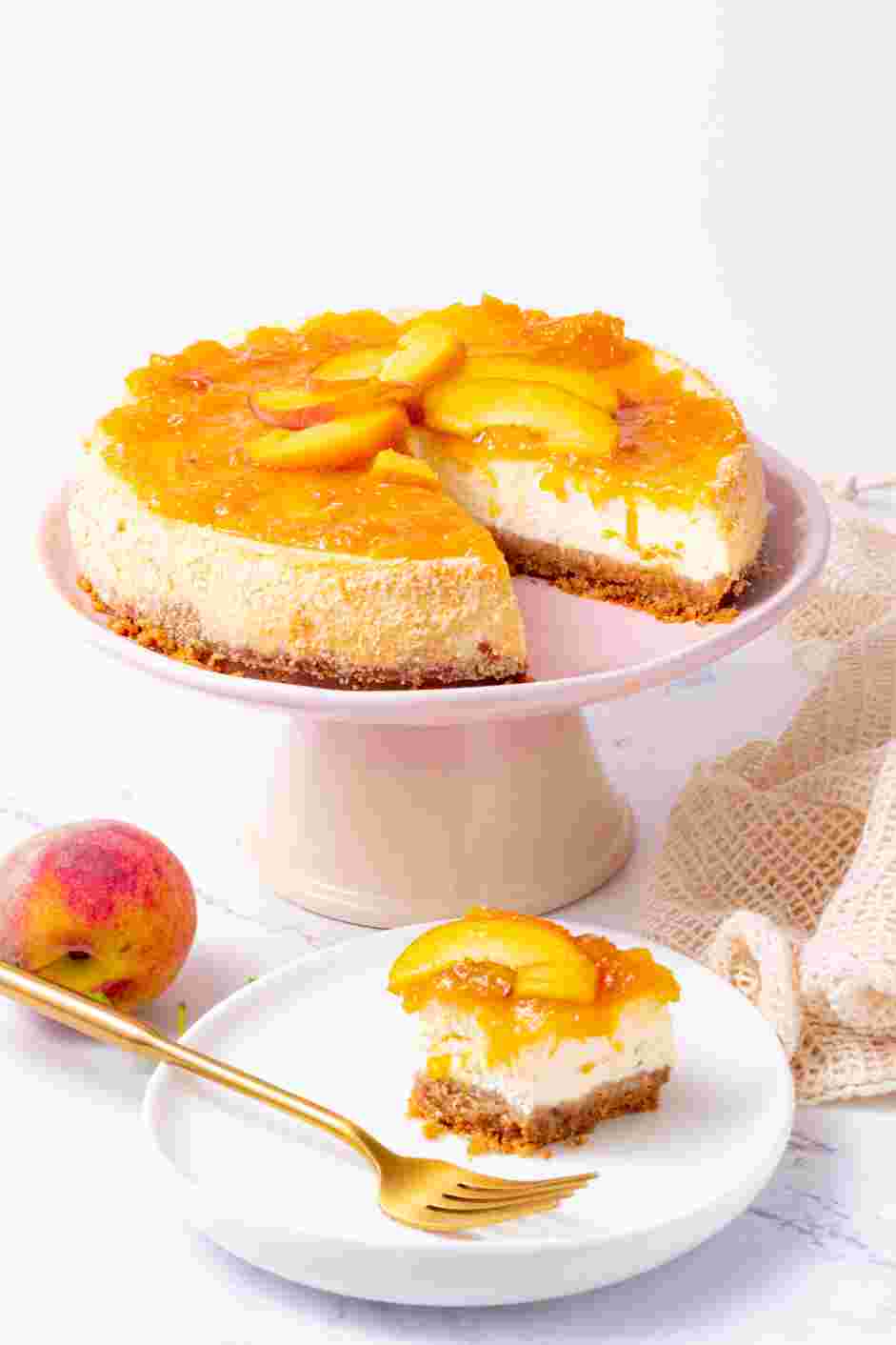 Peach Cobbler Cheesecake Recipe: Spread the peach topping on top and garnish with powdered sugar if desired.