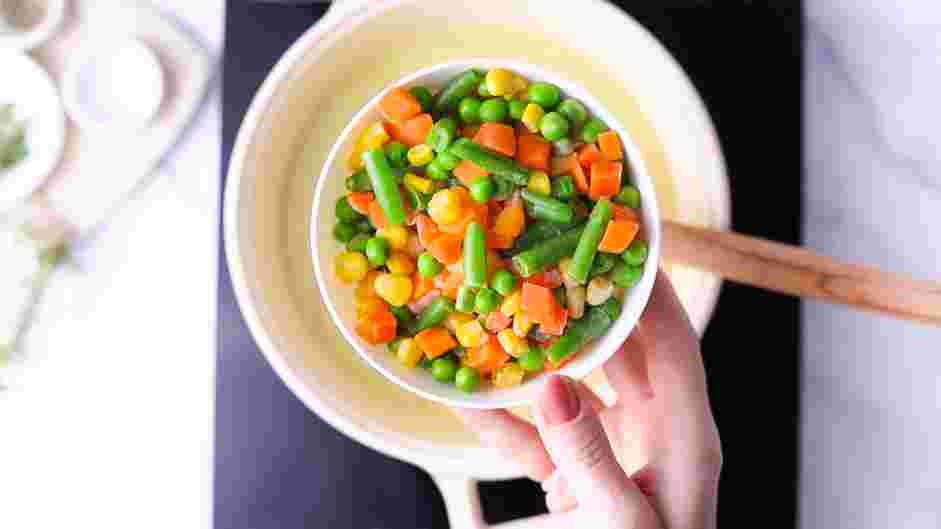 Vegan Pot Pie Recipe: Stir in the chickpeas and the frozen vegetables.