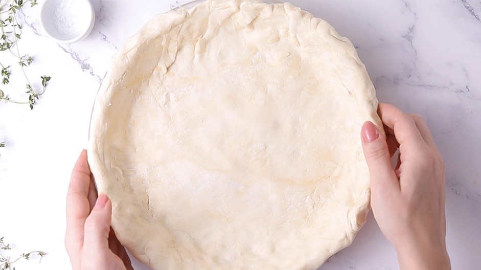 Vegan Pot Pie Recipe: In a 9-inch deep glass pie dish, press in one roll of pie dough.