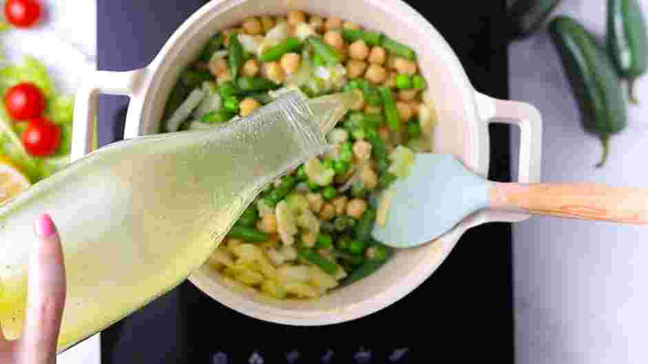 Vegan Stew Recipe: Stir in the vegetable stock, diced jalapeño, cherry tomatoes and nutritional yeast.