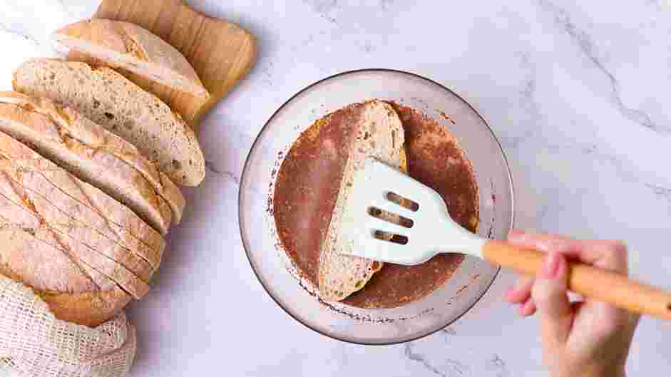 Sourdough French Toast Recipe: Dunk the sourdough bread into the custard until saturated on each side.