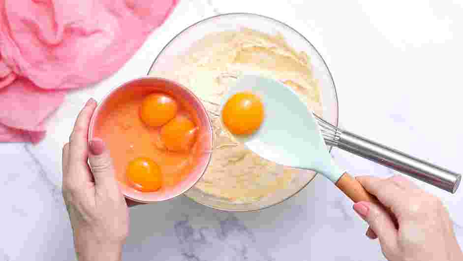 Raspberry Cake Recipe: Whisk in the eggs a little at a time.