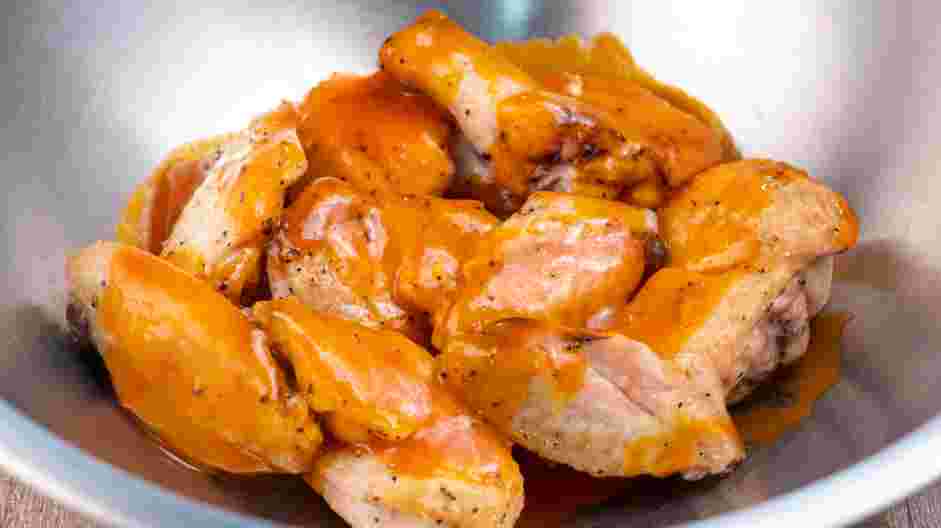 Air Fryer Chicken Wings Recipe: Flip the chicken in the basket again and fry for 9 minutes at 390°F.