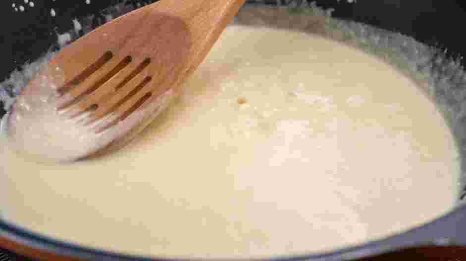 Keto Alfredo Sauce Recipe: Whisk in the freshly grated Parmesan cheese.