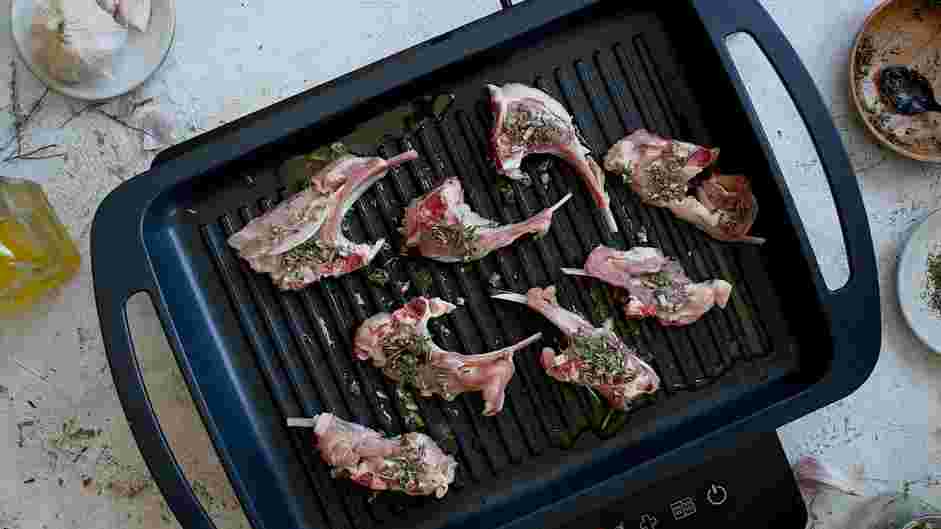 Herb-Crusted Lamb Lollipops Recipe: Heat a cast-iron pan over medium heat until warm.