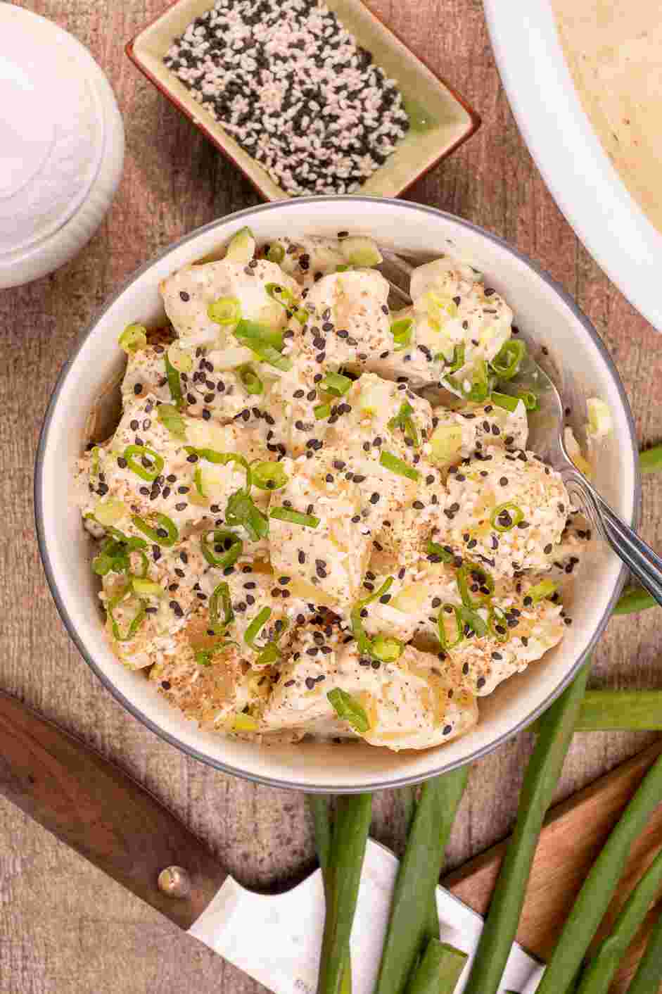 Japanese Potato Salad Recipe: Garnish with scallions, shichimi togarashi and sesame seeds.