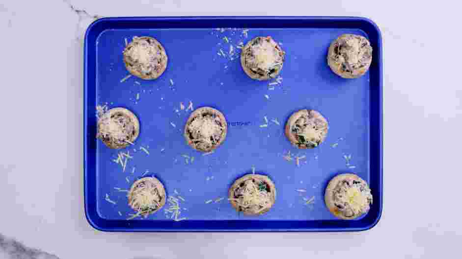 Keto Stuffed Mushrooms Recipe: Fill each mushroom cap with the sausage mixture and sprinkle the Parmesan cheese on top of the prepared stuffed mushrooms.