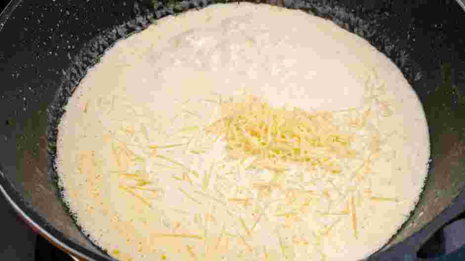 Cajun Chicken Alfredo Recipe: Whisk in the freshly grated parmesan cheese and cream cheese.