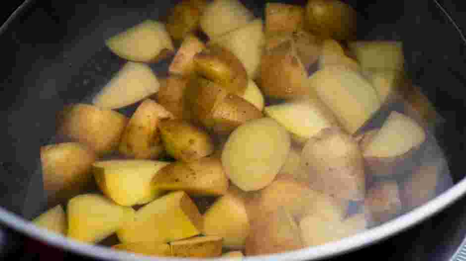 Fried Potatoes and Onions Recipe: Bring a pot of salted water to a rolling boil.