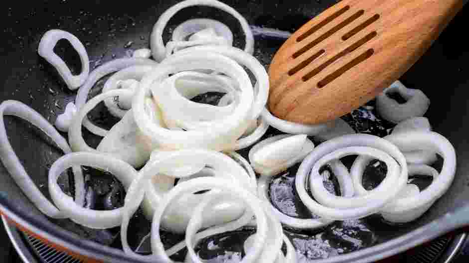 Fried Potatoes and Onions Recipe: While potatoes are cooking, heat a cast iron pan on medium-high heat.