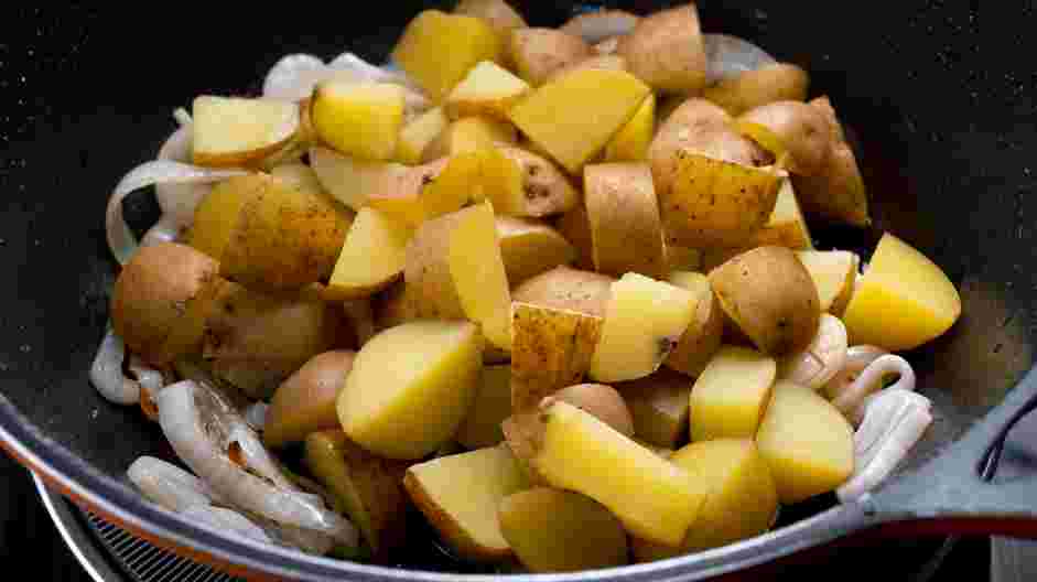 Fried Potatoes and Onions Recipe: Once the onions are cooked, lower the heat to medium and add the remaining two tablespoons of avocado oil and the potatoes.