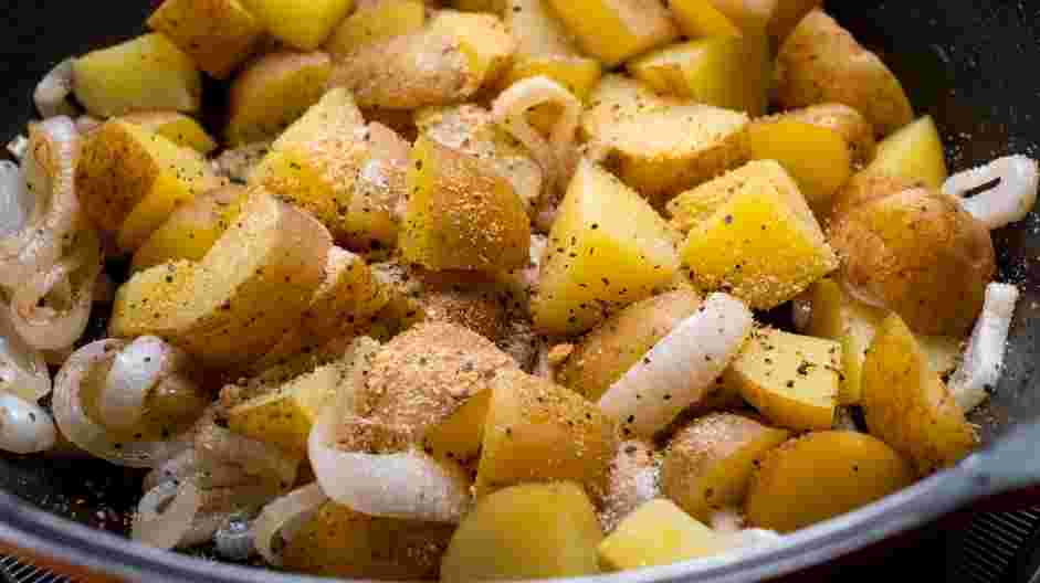 Fried Potatoes and Onions Recipe: Gently mix in the garlic powder, salt and pepper.
