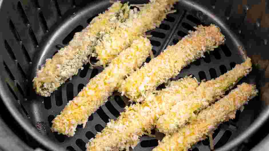 Air Fryer Zucchini Fries Recipe: Spray the inside of the air fryer basket with cooking spray and arrange the zucchini fries in a single layer, leaving a little space between each fry.