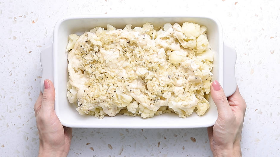 Cauliflower Gratin Recipe: Pour the b&eacute;chamel sauce over the cauliflower and top it evenly with the seasoned bread crumbs.