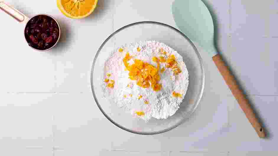 Cranberry Orange Scones Recipe: In the bowl of a food processor or a mixing bowl, add the flour, sugar, baking powder, orange zest and salt.