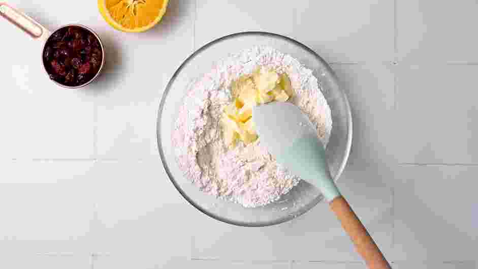 Cranberry Orange Scones Recipe: Add the cold butter and pulse or mix until coarse crumbs form.