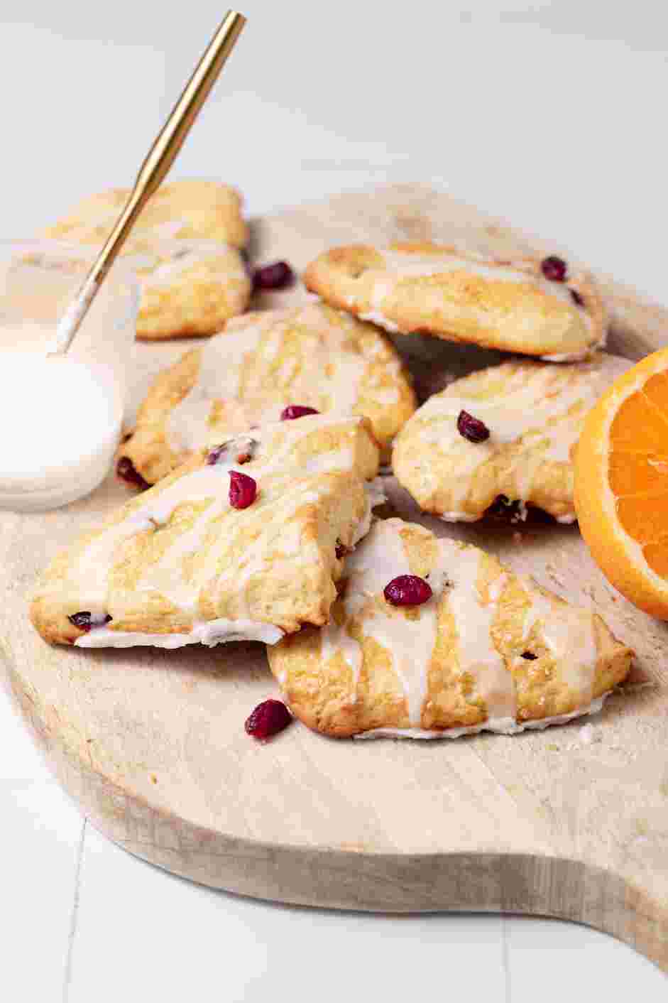 Cranberry Orange Scones Recipe: Drizzle the glaze over the cooled scones and serve.