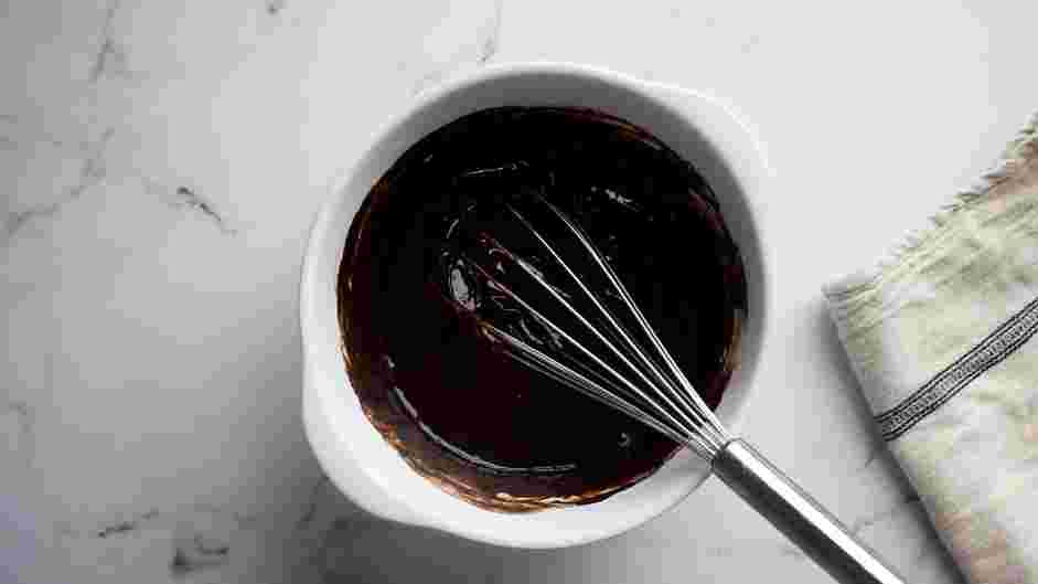 Chocolate Lava Cake Recipe: Whisk in the eggs and egg yolks and mix until glossy and smooth, about 2-3 minutes.