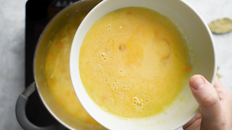 Greek Lemon Chicken Soup Recipe: While whisking constantly, slowly drizzle the egg mixture into the soup.