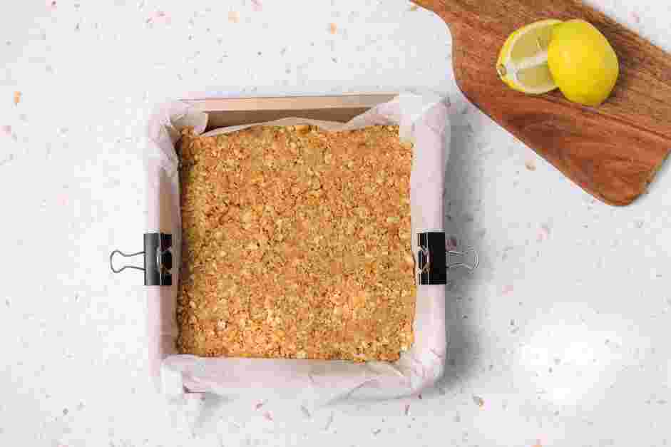 Lemon Cheesecake Bars Recipe: 
Transfer the mixture into the prepared baking pan and press the mixture into the bottom.