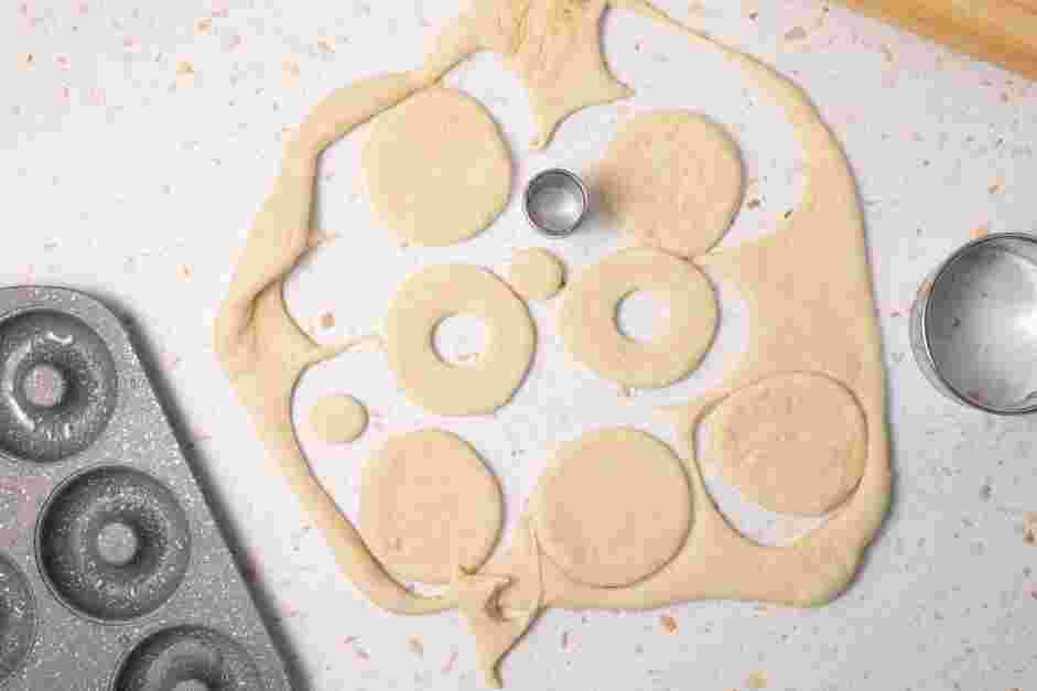 Strawberry Donuts Recipe: Using a 2 ¾-inch round cookie cutter, cut out large circles of dough.