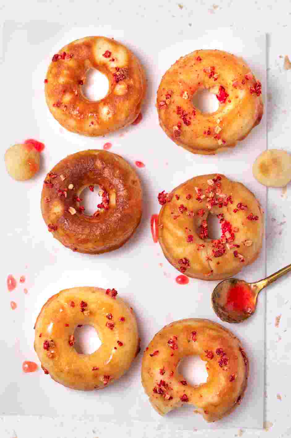 Strawberry Donuts Recipe: Dip the donuts in the strawberry glaze and top with freeze-dried strawberries.