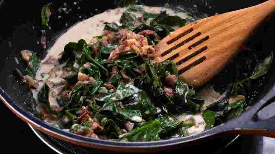 Keto Creamed Spinach Recipe: Fold in the bacon, onions, mushrooms and spinach into the b&eacute;chamel sauce.