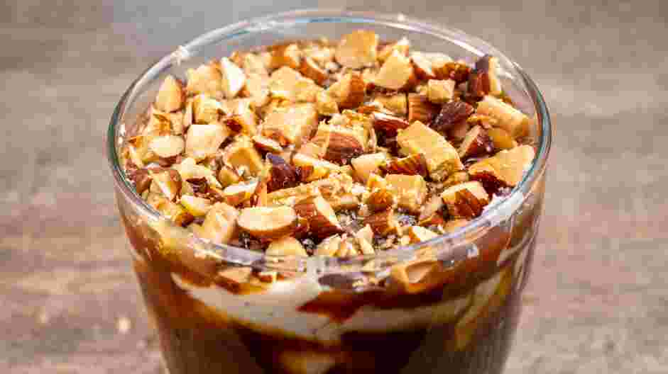 Caramel Apple Dip Recipe: Sprinkle the top with the toffee bits and chopped hazelnuts.