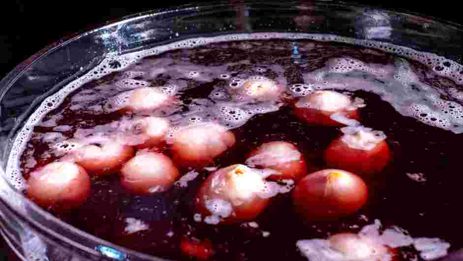 Halloween Punch Recipe: Stir in the lychee eyes.