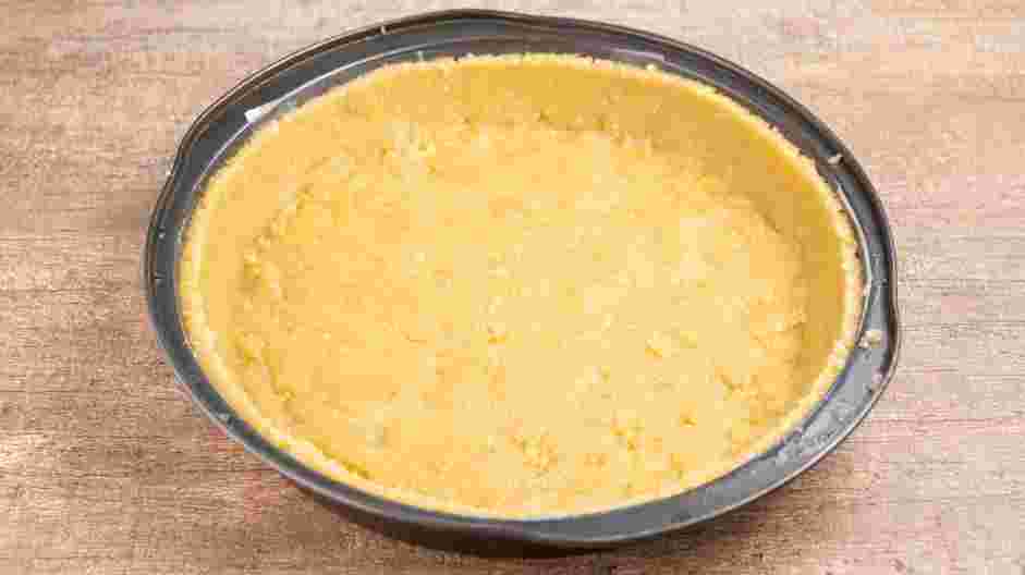 Keto Quiche Recipe: Press the mixture into the base and up the sides of a 10-inch quiche dish or pan.