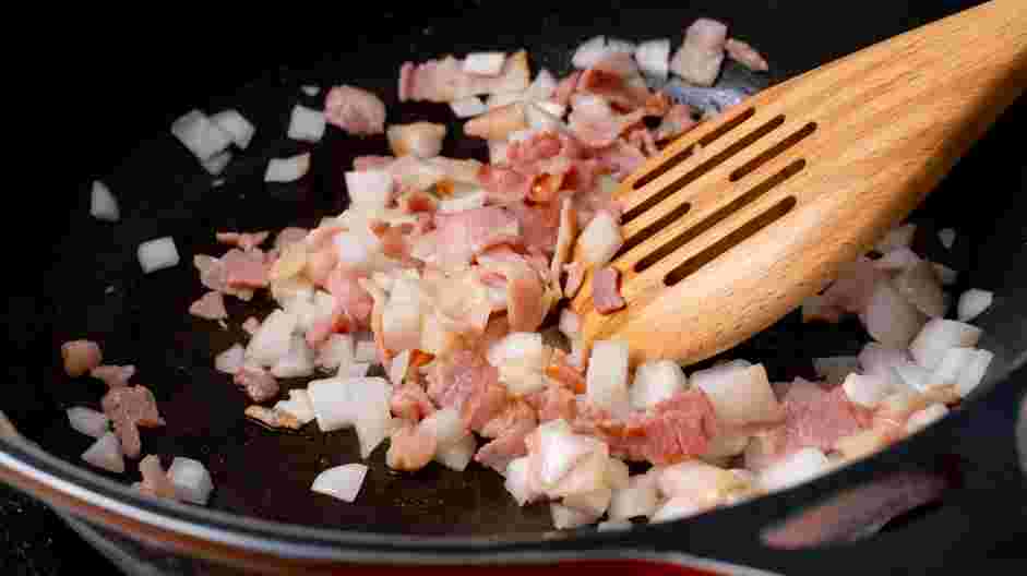 Keto Quiche Recipe: In a nonstick frying pan over medium heat, sauté the bacon and onion until the onion is translucent.