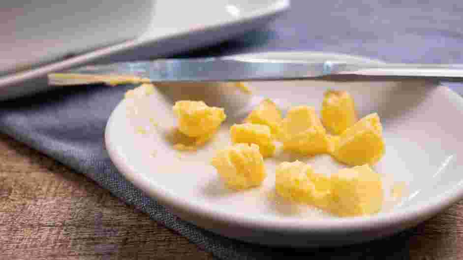 Fluffy Scrambled Eggs Recipe: Dice &frac12; tablespoon of cold butter into small cubes.