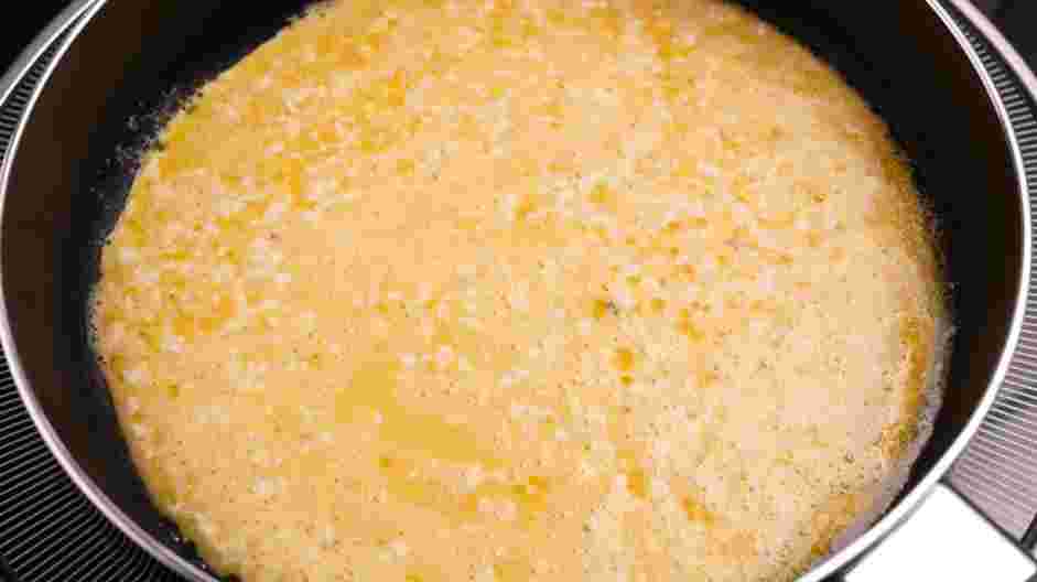 Fluffy Scrambled Eggs Recipe: In a small nonstick skillet over medium-low heat, melt the remaining ½ tablespoon of butter.