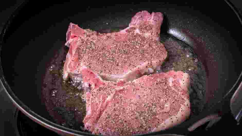 Skillet Pork Chops Recipe: Heat ghee in a large cast iron skillet over medium-high heat.