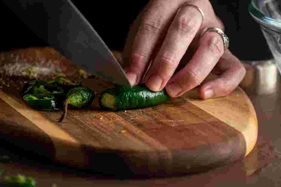 Spicy Margarita Recipe: In the cup of a shaker, muddle one thin slice of jalapeño.