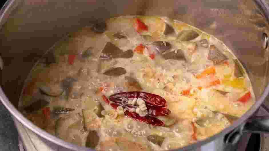 Eggplant Curry Recipe: Add the garlic, ginger, lemongrass, dried chilies and galangal root.