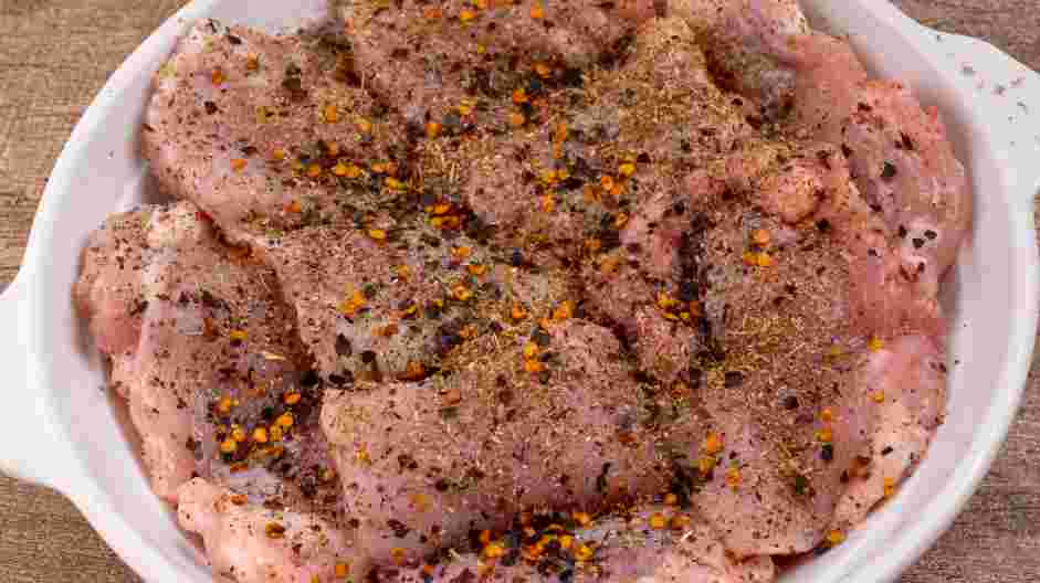 Greek Chicken Recipe: Season the chicken with red chili flakes, dried oregano, pepper and salt.