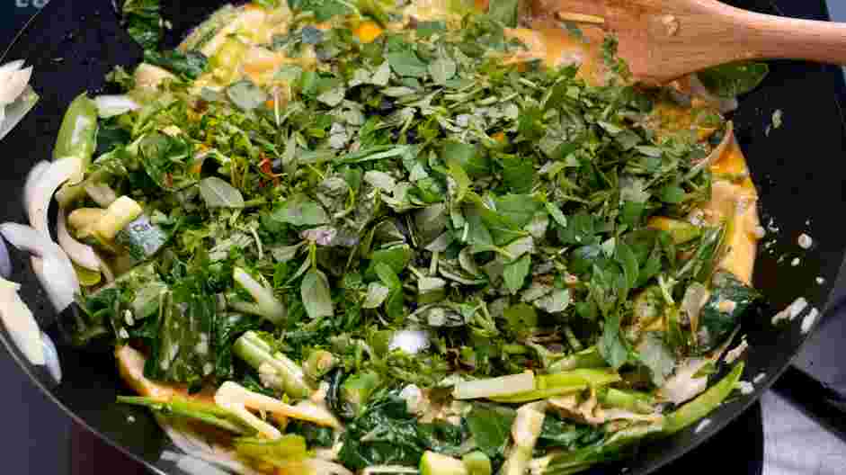 Thai Red Curry (Vegetarian) Recipe: Add the cilantro, basil, lime juice and zest, mint, Kaffir lime leaves, coconut aminos, smoked paprika, curry powder, turmeric, coriander and black pepper.