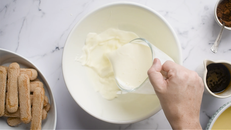 Italian Tiramisu Recipe: In a separate mixing bowl, add the heavy cream and a pinch of salt.