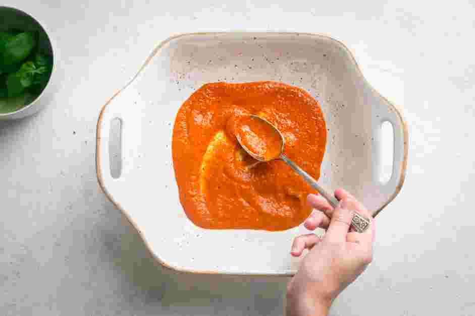 Ricotta Stuffed Shells Recipe: In a 9x13-inch baking dish, spread eight ounces of marinara sauce on the bottom of the baking dish.