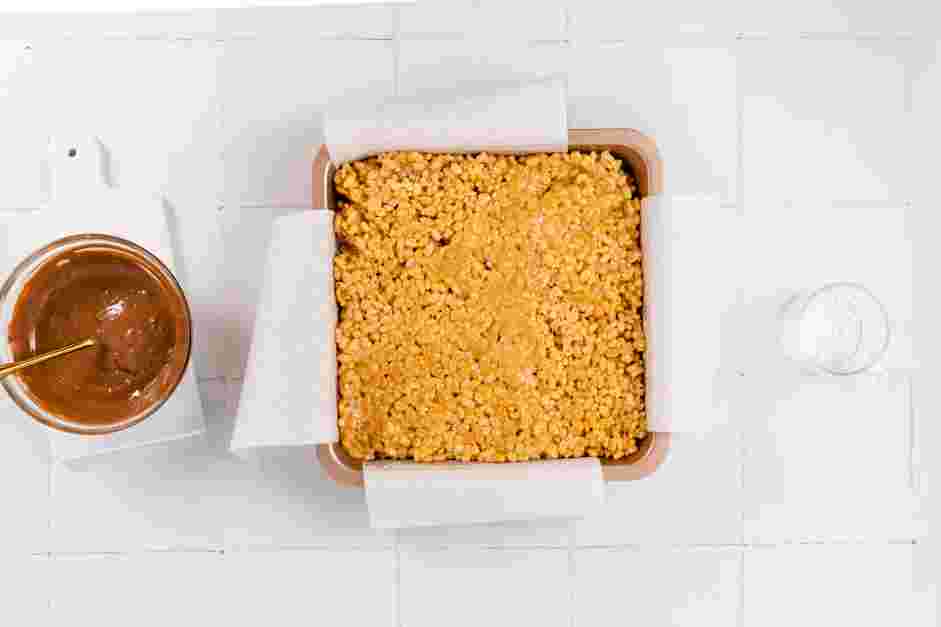 Peanut Butter Rice Krispie Treats Recipe: 
Transfer the mixture to the prepared baking pan.