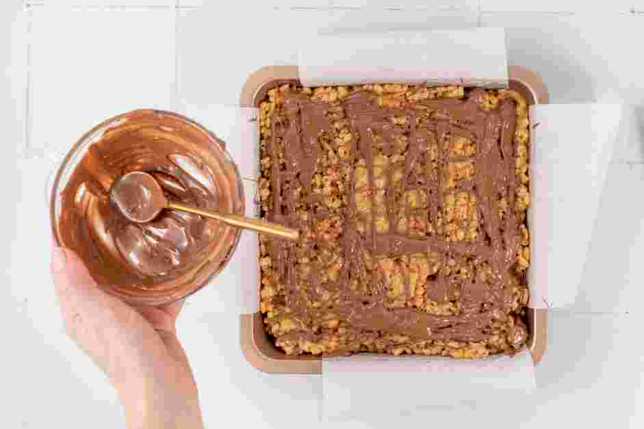 Peanut Butter Rice Krispie Treats Recipe: Drizzle melted chocolate over the rice krispie treats and lightly sprinkle the top with Maldon salt, if desired.