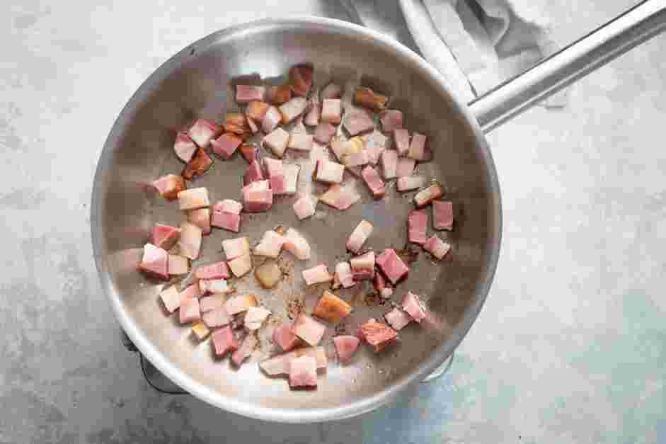 Traditional Carbonara Recipe: In a large pan over medium heat, gently brown the guanciale until the outside is crunchy and the inside is juicy.