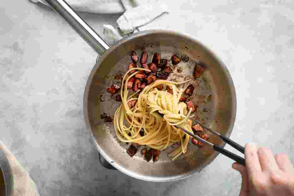 Traditional Carbonara Recipe: Transfer the cooked pasta to the pan with the guanciale.