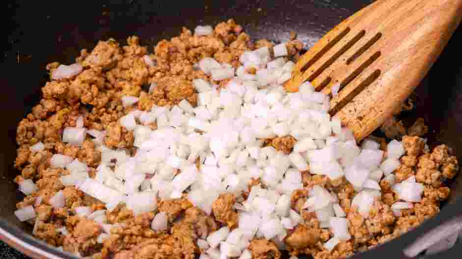 Sausage Dip Recipe:
Drain the skillet of excess fat and add the diced onions.