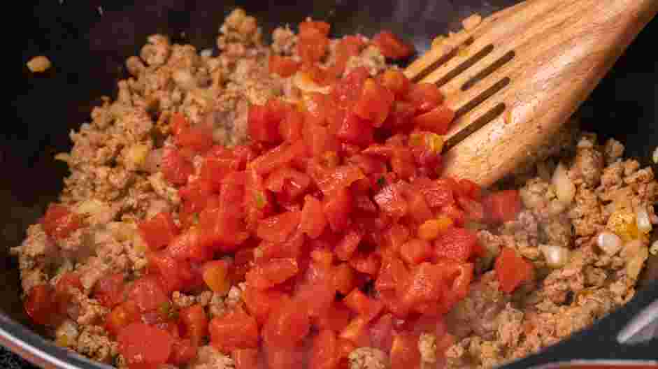 Sausage Dip Recipe: Stir in the diced tomatoes and simmer for 5 minutes
