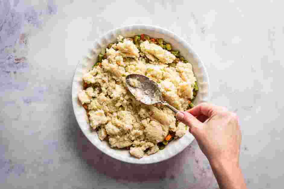 Vegan Shepherd's Pie Recipe: Top the vegetable mixture with the cauliflower mash, spreading from edge to edge.