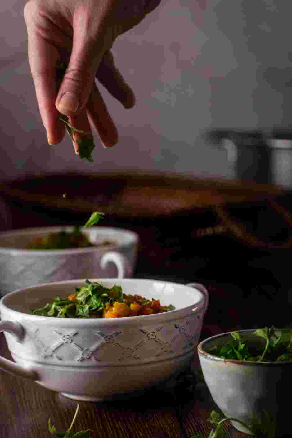 Vegan Lentil Soup Recipe: Ladle soup into bowls and garnish with fresh parsley.