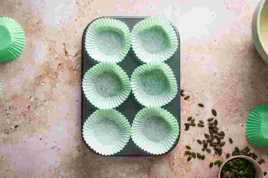 Pumpkin Cream Cheese Muffins Recipe: Preheat the oven to 350°F.