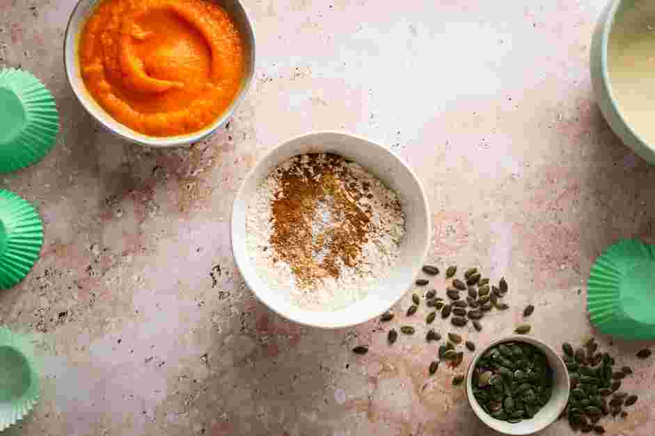 Pumpkin Cream Cheese Muffins Recipe: In a medium mixing bowl, whisk together the flour, baking soda, cinnamon, ginger, nutmeg and salt.